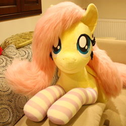 Size: 3247x3247 | Tagged: safe, artist:ponimalion, fluttershy, pegasus, pony, g4, bed, clothes, female, high res, irl, life size, mare, photo, plushie, socks, solo, striped socks