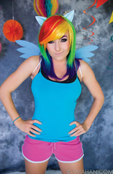 Size: 586x900 | Tagged: safe, artist:jessica nigri, rainbow dash, human, g4, 2015, clothes, cosplay, costume, hand on hip, irl, irl human, photo, shorts, sleeveless, tank top