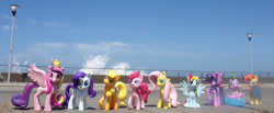 Size: 2048x846 | Tagged: safe, artist:dingopatagonico, applejack, fluttershy, pinkie pie, princess cadance, rainbow dash, rarity, spike, sunburst, twilight sparkle, pony, g4, irl, mane six, photo, toy