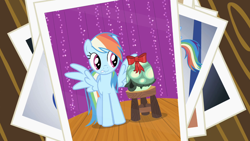 Size: 1280x720 | Tagged: safe, editor:rarity vrymer collective, screencap, rainbow dash, tank, pegasus, pony, tortoise, g4, may the best pet win, bow, multicolored hair, multicolored mane, multicolored tail, photo, spread wings, stool, tail, wings