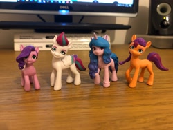 Size: 4032x3024 | Tagged: safe, izzy moonbow, pipp petals, sunny starscout, zipp storm, earth pony, pegasus, pony, unicorn, g5, my little pony: a new generation, figurine, irl, photo, pipp is short, toy