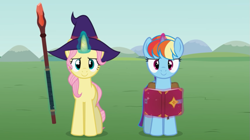 Size: 851x477 | Tagged: safe, artist:agrol, fluttershy, rainbow dash, pony, unicorn, let's start the game, g4, alternate hairstyle, book, duo, duo female, female, glowing, glowing horn, hairstyle, hat, horn, looking at you, magic, magic aura, race swap, smiling, smiling at you, smirk, spellbook, staff, telekinesis, unicorn fluttershy, unicorn rainbow dash, wizard hat, youtube link