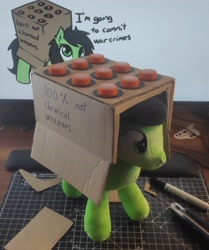 Size: 1899x2268 | Tagged: safe, artist:neuro, artist:seikenryu, oc, oc only, oc:filly anon, earth pony, pony, bottlecap, cardboard box, female, filly, irl, missile, photo, plushie, simple background, solo