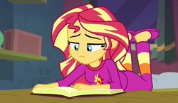Size: 1241x720 | Tagged: safe, screencap, sunset shimmer, equestria girls, equestria girls specials, g4, my little pony equestria girls: better together, my little pony equestria girls: forgotten friendship, bed, book, clothes, female, lying down, pajamas, slippers, solo