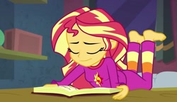 Size: 1253x720 | Tagged: safe, screencap, sunset shimmer, equestria girls, equestria girls specials, g4, my little pony equestria girls: better together, my little pony equestria girls: forgotten friendship, barefoot, book, clothes, eyes closed, feet, female, lying down, pajamas, smiling, solo