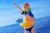 Size: 1080x722 | Tagged: safe, artist:natsumipon, rainbow dash, human, g4, beach, clothes, cosplay, costume, floaty, inflatable bird, inflatable duck, inner tube, irl, irl human, ocean, opaque inflatable, outdoors, photo, pointing, pool toy, seams, standing, swimsuit, water, wearing a swim ring, wrinkles