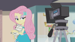 Size: 3410x1920 | Tagged: safe, screencap, fluttershy, dog, equestria girls, equestria girls series, g4, outtakes (episode), clothes, cutie mark on clothes, female, geode of fauna, hairpin, high res, jewelry, magical geodes, necklace, smiling, smug, smugshy, video camera