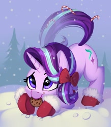 Size: 2026x2324 | Tagged: safe, artist:taneysha, starlight glimmer, pony, unicorn, behaving like a dog, booties, bow, candy, candy cane, cheek fluff, christmas, clothes, cookie, cute, ear fluff, face down ass up, female, fir tree, food, glimmerbetes, hair bow, high res, holiday, mare, mouth hold, shoes, smiling, snow, snowfall, solo, tree, winter