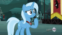Size: 498x280 | Tagged: safe, screencap, trixie, pony, unicorn, magic duel, season 3, alicorn amulet, all new, animated, evil trixie, female, gif, horn, hub logo, lidded eyes, mare, outdoors, raised hoof, smiling, solo, standing, tail, text, two toned mane, two toned tail
