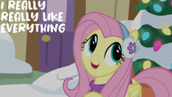 Size: 1280x720 | Tagged: safe, edit, edited screencap, editor:quoterific, screencap, fluttershy, pegasus, pony, g4, my little pony best gift ever, christmas, christmas lights, christmas tree, cute, earmuffs, female, holiday, mare, open mouth, open smile, shyabetes, smiling, snow, solo, tree