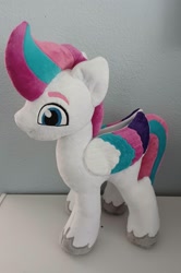 Size: 1588x2392 | Tagged: safe, artist:cinnamon-stitch, zipp storm, pegasus, pony, g5, my little pony: a new generation, colored wings, eyebrows, female, folded wings, irl, mare, multicolored wings, photo, plushie, side view, smiling, solo, standing, tail, two toned mane, two toned tail, unshorn fetlocks, wings