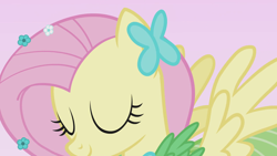 Size: 1920x1080 | Tagged: safe, screencap, fluttershy, pegasus, pony, g4, suited for success, clothes, dress, female, flower, flower in hair, gala dress, mare, pink background, simple background, solo