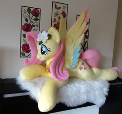 Size: 1140x1069 | Tagged: safe, artist:purplenebulastudios, fluttershy, pegasus, pony, g4, colored wings, cute, irl, life size, lying down, multicolored wings, photo, plushie, prone, shyabetes, solo, wings