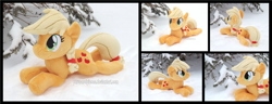 Size: 4545x1754 | Tagged: safe, artist:peruserofpieces, applejack, earth pony, pony, g4, beanie (plushie), female, happy, irl, looking at you, lying down, mare, photo, plushie, prone, smiling, snow, sploot, tree