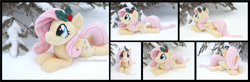Size: 5340x1754 | Tagged: safe, artist:peruserofpieces, fluttershy, pegasus, pony, g4, beanie (plushie), cute, female, happy, holly, irl, looking at you, lying down, mare, photo, plushie, prone, shyabetes, smiling, smiling at you, snow, solo, sploot, tree, wings