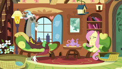 Size: 1920x1080 | Tagged: safe, screencap, discord, fluttershy, draconequus, pegasus, pony, g4, make new friends but keep discord, bird house, couch, cup, duo, female, fluttershy's cottage, fluttershy's cottage (interior), grin, laughing, male, mare, mouse hole, pillow, sitting, smiling, teacup, teapot