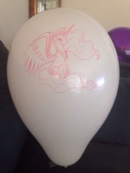 Size: 600x800 | Tagged: artist needed, safe, princess celestia, alicorn, pony, g4, balloon, irl, lidded eyes, photo, sitting, solo, spread wings, wings