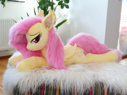 Size: 3024x2268 | Tagged: safe, artist:epicrainbowcrafts, fluttershy, bat pony, pony, g4, bat ponified, bedroom eyes, flutterbat, high res, irl, lying down, photo, plushie, prone, race swap, solo