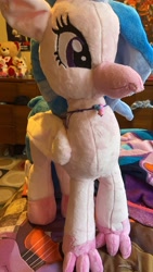 Size: 1980x3520 | Tagged: safe, artist:mezairplush, photographer:savygriffs, silverstream, hippogriff, g4, bed, female, irl, jewelry, necklace, photo, plushie