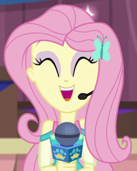Size: 562x699 | Tagged: safe, screencap, fluttershy, best in show: the victory lap, equestria girls, g4, my little pony equestria girls: better together, ^^, cropped, cute, earpiece, eyes closed, eyeshadow, fluttershy boho dress, geode of fauna, giggling, jewelry, magical geodes, makeup, microphone, necklace, open mouth, open smile, pink eyeshadow, pink hair, shyabetes, sleeveless, smiling, solo, yellow skin