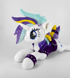 Size: 1024x1132 | Tagged: safe, artist:gingerale2016, rarity, pony, g4, alternate hairstyle, clothes, deviantart watermark, irl, jacket, lying down, obtrusive watermark, photo, plushie, prone, punk, raripunk, solo, watermark