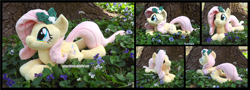 Size: 4890x1754 | Tagged: safe, artist:peruserofpieces, fluttershy, pegasus, pony, g4, beanie (plushie), female, flower, holly, irl, lying down, mare, photo, plushie, prone, smiling, sploot, tree, wings