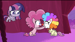Size: 828x467 | Tagged: safe, screencap, fluttershy, pinkie pie, twilight sparkle, alicorn, earth pony, pegasus, pony, g4.5, lolly-pop, my little pony: pony life, chubby cheeks, clown, clown makeup, clown nose, clown wig, curtains, female, flutterclown, flying, holding a pony, red nose, sitting, squished face, trio, trio female, twilight sparkle (alicorn)