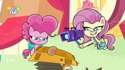 Size: 1024x576 | Tagged: safe, screencap, fluttershy, pinkie pie, earth pony, pegasus, pony, g4.5, my little pony: pony life, the crystal capturing contraption, spoiler:pony life s02e02, camera, female, fluttertroll, mare