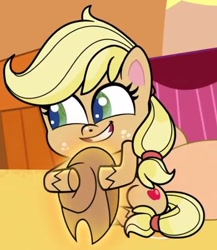 Size: 446x514 | Tagged: safe, screencap, applejack, earth pony, pony, g4.5, my little pony: pony life, the great cowgirl hat robbery, spoiler:pony life s02e10, applejack's hat, cowboy hat, cropped, cute, female, hat, hatless, hug, jackabetes, missing accessory, sitting, solo, teeth