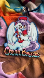 Size: 675x1200 | Tagged: safe, artist:twisted-sketch, oc, oc:ocean breeze, hippogriff, badge, blanket, blushing, claws, clothes, football, hat, hippogriff oc, irl, jersey, kansas city chiefs, photo, sports, traditional art, wings