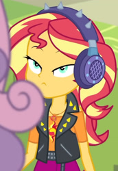 Size: 1920x2798 | Tagged: safe, screencap, sunset shimmer, sweetie belle, equestria girls, equestria girls series, g4, overpowered (equestria girls), clothes, cropped, cutie mark, cutie mark on clothes, female, geode of empathy, hallway, headphones, high res, jacket, jewelry, leather, leather jacket, lidded eyes, lockers, magical geodes, necklace, shrunken pupils, solo focus