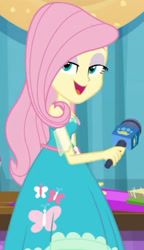 Size: 1920x3333 | Tagged: safe, screencap, fluttershy, best in show: the pre-show, equestria girls, equestria girls series, g4, spoiler:eqg series (season 2), bedroom eyes, best in show logo, clothes, cropped, cutie mark, cutie mark on clothes, female, geode of fauna, jewelry, magical geodes, microphone, necklace, open mouth, smiling, smugshy, solo