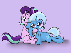 Size: 3368x2540 | Tagged: safe, artist:background basset, starlight glimmer, trixie, pony, unicorn, g4, blushing, duo, duo female, female, floppy ears, high res, holding hooves, horn, hug, lesbian, looking at each other, looking at someone, lying down, mare, pink background, ship:startrix, shipping, simple background, smiling, smiling at each other