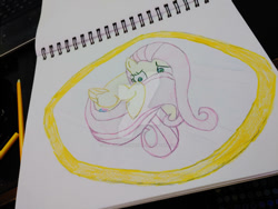 Size: 400x300 | Tagged: safe, artist:dougtheloremaster, fluttershy, pegasus, pony, g4, deviantart watermark, frightened, hiding behind tail, nervous, obtrusive watermark, pencil, pencil drawing, photo, scared, sketchpad, timid, traditional art, watermark