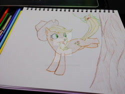 Size: 400x300 | Tagged: safe, artist:dougtheloremaster, applejack, earth pony, pony, g4, applebucking, deviantart watermark, obtrusive watermark, pencil, pencil drawing, photo, sketchpad, traditional art, watermark