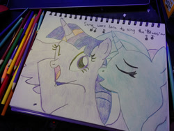 Size: 1280x960 | Tagged: safe, artist:dougtheloremaster, part of a set, trixie, twilight sparkle, alicorn, pony, unicorn, g4, don't stop believing, eyes closed, female, journey (band), lesbian, one eye closed, open mouth, open smile, part of a series, pencil, pencil drawing, photo, ship:twixie, shipping, sketchpad, smiling, song reference, traditional art, twilight sparkle (alicorn), wink