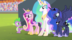 Size: 1920x1080 | Tagged: safe, screencap, princess cadance, princess celestia, princess luna, spike, alicorn, dragon, pony, equestria games (episode), g4, crown, crystal stadium, female, happy, height difference, jewelry, male, mare, open mouth, regalia, spread wings, text, wings