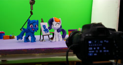 Size: 6408x3388 | Tagged: safe, artist:inspiranimation, rainbow dash, rarity, pegasus, pony, unicorn, g4.5, my little pony: stop motion short, rarity's paintful pony portrait, absurd resolution, behind the scenes, camera, clay, covered in paint, duo, duo female, female, green screen, irl, mare, paint, paint on fur, photo