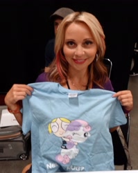 Size: 2088x2621 | Tagged: safe, sweetie belle, human, bronycon, bronycon 2012, g4, bubbles (powerpuff girls), clothes, eyes closed, high res, hug, irl, irl human, one eye closed, photo, shirt, t-shirt, tara strong, the powerpuff girls, voice actor, wink