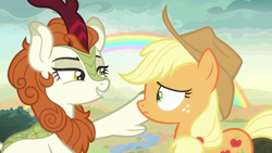 Size: 1920x1080 | Tagged: safe, screencap, applejack, autumn blaze, earth pony, kirin, pony, g4, season 8, sounds of silence, applejack's hat, cowboy hat, duo, duo female, female, frown, grin, hat, lidded eyes, lip bite, looking at each other, mare, rainbow, smiling