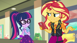 Size: 1920x1077 | Tagged: safe, screencap, sci-twi, sunset shimmer, twilight sparkle, equestria girls, equestria girls series, g4, holidays unwrapped, o come all ye squashful, spoiler:eqg series (season 2), geode of empathy, magical geodes, phone
