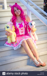 Size: 866x1390 | Tagged: safe, fluttershy, pinkie pie, human, g4, clothes, cosplay, costume, dress, irl, irl human, obtrusive watermark, photo, plushie, sandals, stock photo, watermark