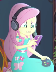 Size: 356x458 | Tagged: safe, screencap, fluttershy, costume conundrum, equestria girls, g4, my little pony equestria girls: better together, cellphone, controller, cropped, headphones, headset, phone, solo