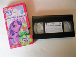 Size: 600x450 | Tagged: safe, kimono, earth pony, pony, a charming birthday, g3, official, irl, looking at you, merchandise, photo, smiling, smiling at you, solo, vhs, video tape
