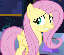 Size: 867x737 | Tagged: safe, screencap, fluttershy, pegasus, pony, g4, party pooped, season 5, cropped, female, grin, mare, nervous, nervous smile, smiling