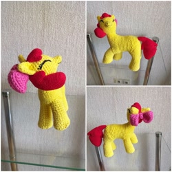Size: 1448x1448 | Tagged: safe, artist:woodiewool, apple bloom, earth pony, pony, g4, amigurumi, crochet, eyes closed, female, filly, glass table, handmade, irl, photo, plushie, smiling, solo