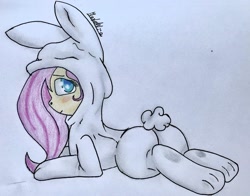 Size: 1080x845 | Tagged: safe, artist:sunset_cake, fluttershy, pegasus, pony, g4, animal costume, blushing, bunny costume, butt, clothes, costume, female, flutterbutt, mare, plot, simple background, solo, traditional art, white background