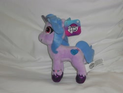 Size: 1600x1200 | Tagged: safe, izzy moonbow, pony, unicorn, g5, ebay, female, irl, mare, my little pony logo, photo, plushie, side view, solo, toy