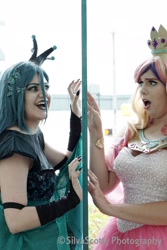 Size: 1365x2048 | Tagged: safe, artist:maddymoiselle, artist:sarahndipity cosplay, artist:silverscotty photography, princess cadance, queen chrysalis, human, g4, 2017, clothes, cosplay, costume, facebook, irl, irl human, long nails, looking at each other, open mouth, photo