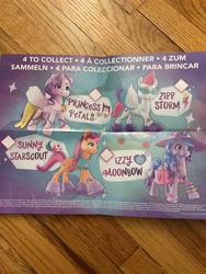 Size: 3024x4032 | Tagged: safe, photographer:errant_harpy, izzy moonbow, pipp petals, sunny starscout, zipp storm, earth pony, pegasus, pony, unicorn, g5, female, irl, mare, photo, poster, toy